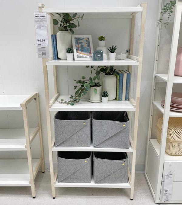 Mixed material shelf with plants, vases and books